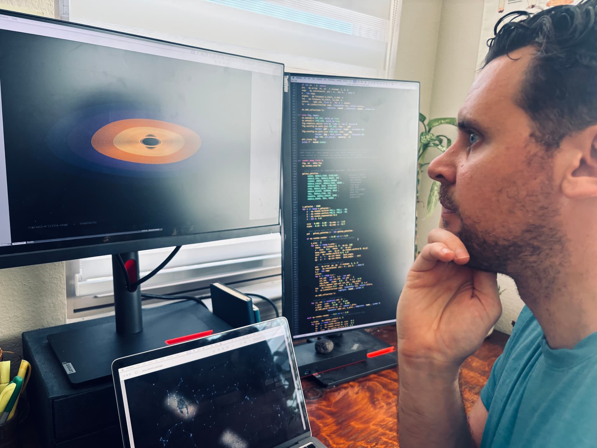 David McCoy at work — Singularity render on one screen, Python code on the other